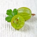 Two gooseberries with leaves