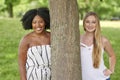 Two gorgeous friends pose for photo in park - summer Royalty Free Stock Photo