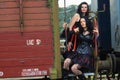 Two gothic girls on a train street style fashion.