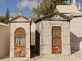 Two grave chapels with rusty iron cast doors on Alto de Sao Joao cemetery, Lisbon