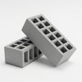 Two Gray Concrete Building Blocks with Rectangular Holes on a White Background construction Royalty Free Stock Photo