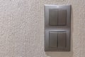 Two gray double light switches mounted on the wall Royalty Free Stock Photo