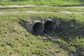 Two Gray Old Concrete Sewer Pipes On The Street