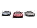 Two gray and one red metallic supercars - front view