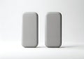 Two gray rectangular objects on a white surface Royalty Free Stock Photo