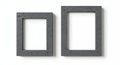 Two gray textured picture frames on a white wall Royalty Free Stock Photo