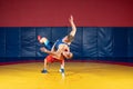 Two greco-roman wrestlers in red and blue uniform Royalty Free Stock Photo