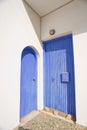 Two Greek blue doors.