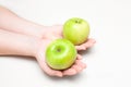 Two green apples in hands Royalty Free Stock Photo