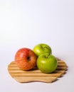 Two green apples and one red apple isolated on white background. Royalty Free Stock Photo