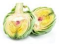 Two green artichoke hearts or artichoke cores isolated on white background