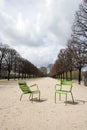 Two Green Chairs on a path In Paris, France Royalty Free Stock Photo
