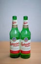 Two green empty Budweiser beer bottles. Royalty Free Stock Photo