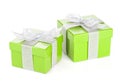 Two green gift boxes with silver ribbon and bow Royalty Free Stock Photo