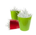 Two green and one red waste basket full with shredded paper Royalty Free Stock Photo