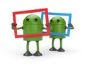Two green robots with picture frame Royalty Free Stock Photo