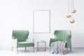 Two green velvet chairs in modern interior space. White  wall background with wooden frame Royalty Free Stock Photo