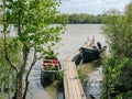 Two green, wooden boats anchored at the pontoon Royalty Free Stock Photo