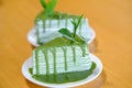 two greentea crepe cake on wood table Royalty Free Stock Photo