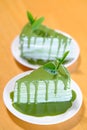two greentea crepe cake on wood table Royalty Free Stock Photo
