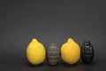Two grenades bomb and two lemon on dark background