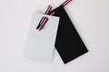 Grey and black tag label with tricolor ribbon french color blue white red isolated in gray background for made in france