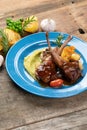 Two grilled lamb chops and potatoes served on pea puree with a mint sauce Royalty Free Stock Photo