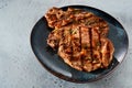 Two grilled pork steaks with seasoning Royalty Free Stock Photo