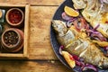 Two grilled trouts with lemon on plate Royalty Free Stock Photo