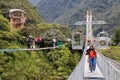 Two group of tourists  on suspension cable bridge Royalty Free Stock Photo