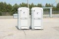 tor, canada - august 19, 2023: two gt gray portable toilets porta potties next to each other in parking lot 77 p 20