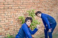 Two guys dabble in gardening