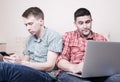 Two guys with gadgets Royalty Free Stock Photo