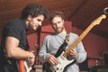 Two guys playing the electric guitar and singing Royalty Free Stock Photo
