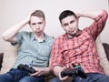 Two guys playing video games Royalty Free Stock Photo