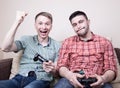 Two guys playing video games Royalty Free Stock Photo