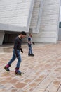 Two guys skating in-line in the street