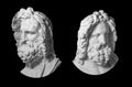 Two gypsum copy of antique statue Zeus head isolated on black background. Plaster sculpture man face with beard. Royalty Free Stock Photo