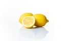 Two and a half lemons isolated on a white background Royalty Free Stock Photo