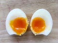 Two half of medium boiled eggs, top view