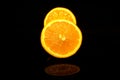 Two half oranges isolated on black Royalty Free Stock Photo