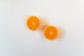 Two half oranges in white background. Healthy fresh fruit, flat lay, copy space Royalty Free Stock Photo