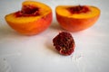 two half peaches on a white background l Royalty Free Stock Photo