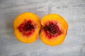 Two half peaches on a white background Royalty Free Stock Photo