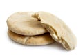 Two and half plain pita breads isolated on white from above.