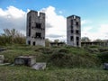 Two half-ruined towers in the wasteland Royalty Free Stock Photo