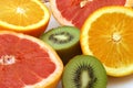 Two halfs of orange pomelo and kiwi Royalty Free Stock Photo