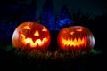 Two Halloween pumpkin in a mystical forest at night. Royalty Free Stock Photo