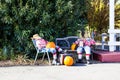 Two Halloween Scarecrows Relaxing With Pumpkins & Suitcases