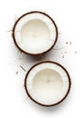 Two halved coconuts with their outer Royalty Free Stock Photo